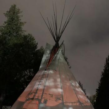 The tipi located on the Peterborough campus. It is lit from the inside