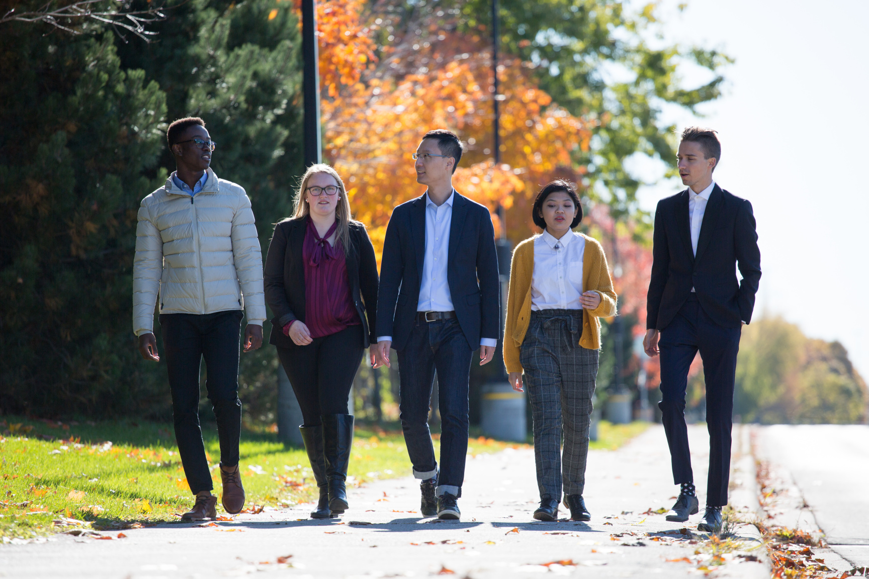 Trent University Durham GTA students walking outside together. 