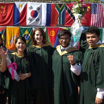 A group of students smiling at convocation